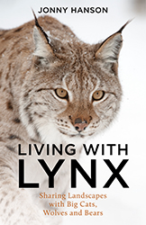 The image shows a book cover titled "LIVING WITH LYNX" by Jonny Hanson. The cover features a close-up photograph of what appears to be a lynx - a wild cat with distinctive tufted ears and amber eyes set against a light background with some snow visible. The subtitle reads "Sharing Landscapes with Big Cats, Wolves and Bears". The cover design is minimalist with bold black text for the title and author name, and smaller orange/copper text for the subtitle.